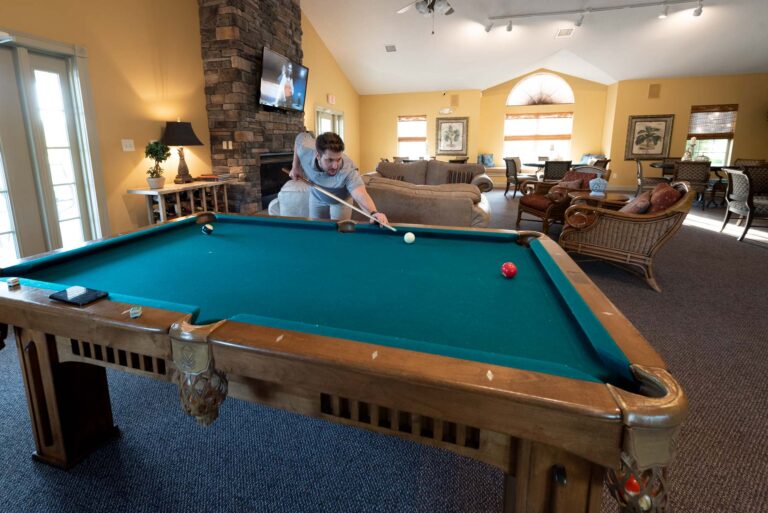 Shooting pool in the Villas clubhouse